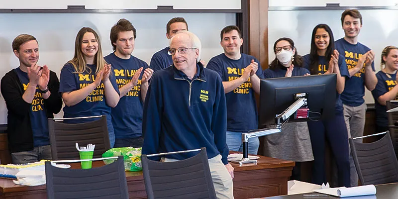 Faculty members joined students in class for the Michigan Law tradition of “clapping out” professors Bob Hirshon and Dave Moran.