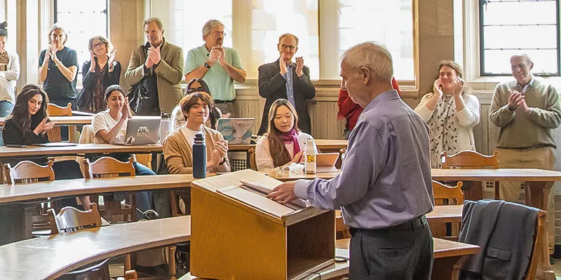 Faculty members joined students in class for the Michigan Law tradition of “clapping out” professors Bob Hirshon and Dave Moran.