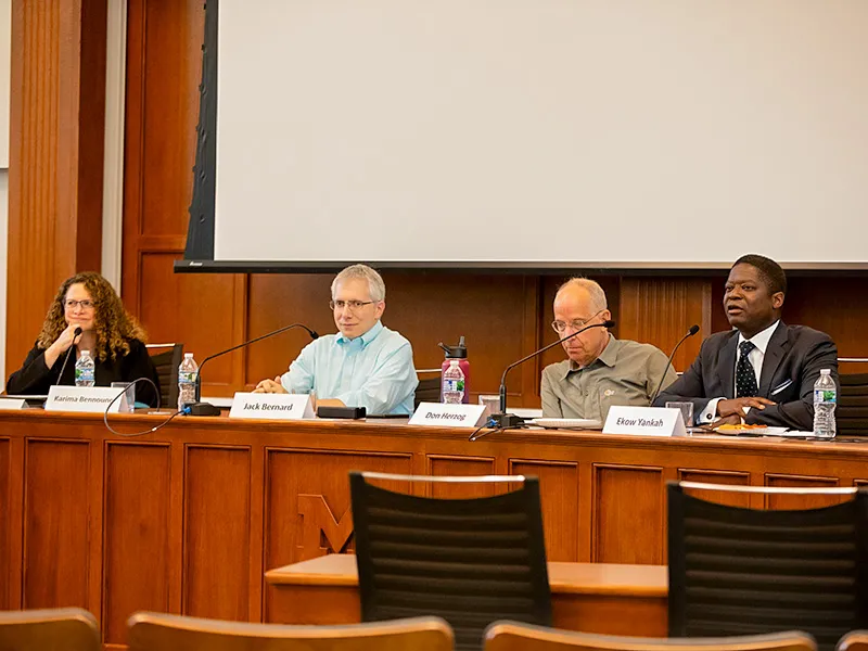 Panel of Michigan Law professors moderating a panel discussion.