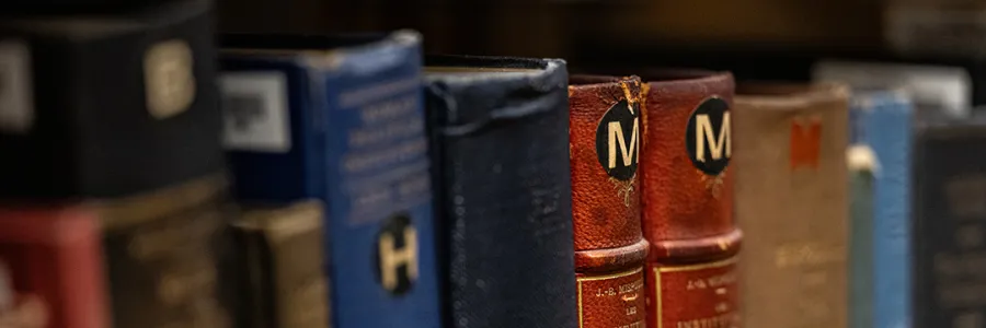 A multicolor row of books at the Michigan Law Library.