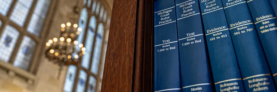 A shelf of Michigan Court Rules Practice books in the Michigan Law Reading Room