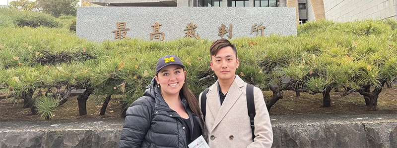 Emily Lovell and Michael Zhao in front of the Supreme Court of Japan 
