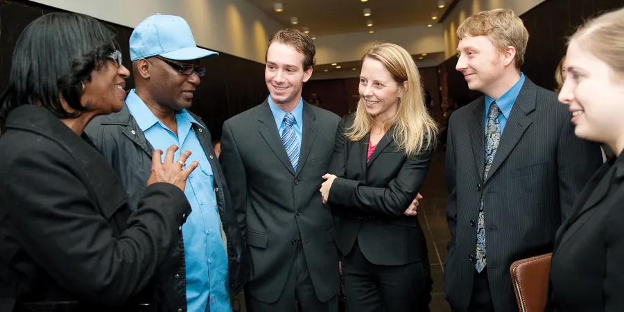 Dwayne Provience’s family talk with student-attorneys Nick Cheolas, Maria Jhai, Brett DeGroff, and Robyn Goldberg