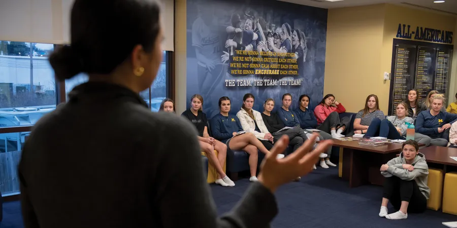 Student-attorney from the Zell Entrepreneurship Clinic speaks to the University of Michigan softball team