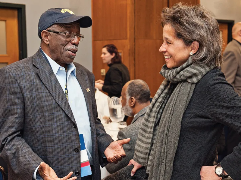 Reunion executive chair Curtis Mack, LLM ’73, talks with Laurel Pyke Malson, a former clerk for Judge Edwards. 