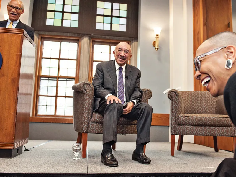 The Hon. Gershwin Drain, ’72, the Hon. Harry Edwards, ’65, and Michele Mayes, ’74, share a laugh during Saturday’s luncheon, where Edwards delivered keynote remarks.