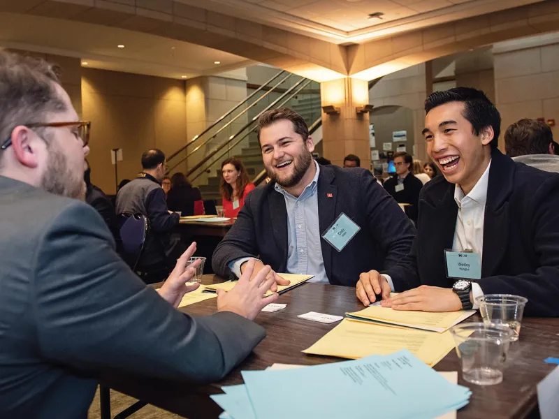 Ryan Watkins, ’13, networks with 1Ls Cody Wiles and Wesley Hungbui during Alumni-Student Speed Mentoring, part of the second Reunion Weekend.
