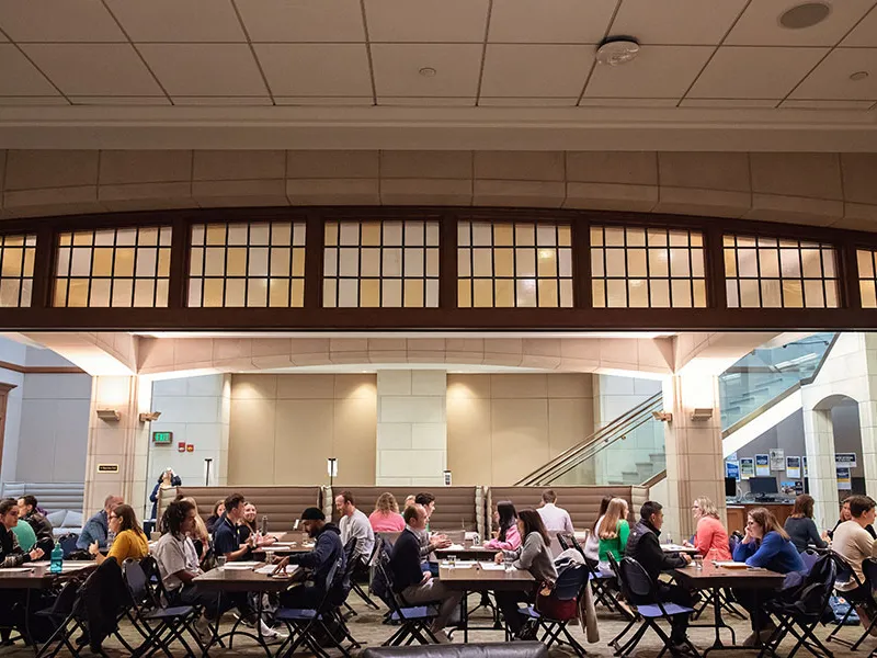 Large group of students sitting at tables.