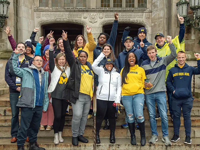 A group of people cheering.