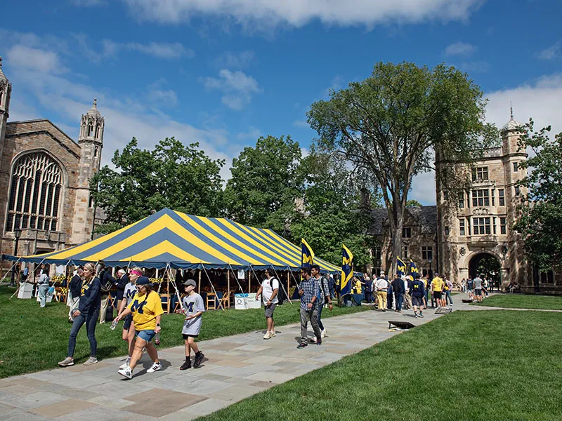 Exterior view of the Law Quad with tent set up for alumni event.