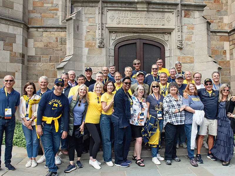 Group of Alumni cheering.