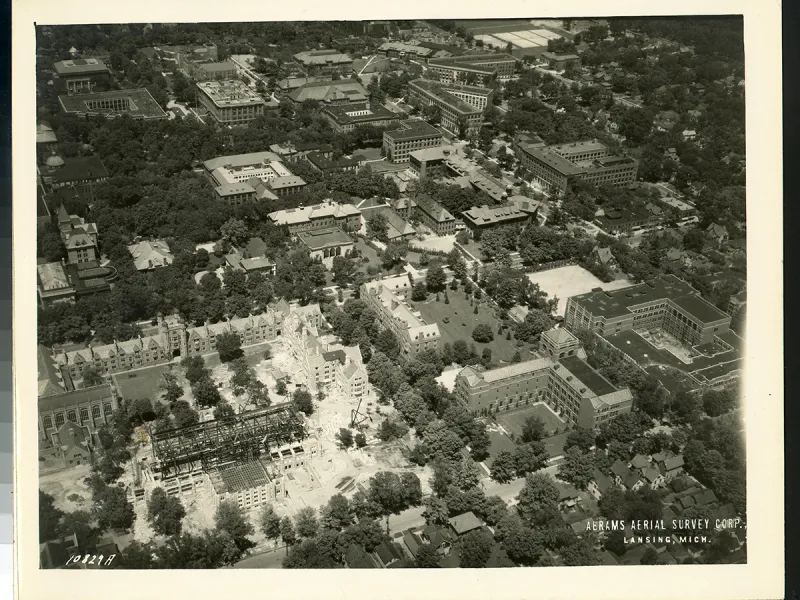 The Law Quad nears completion, its buildings covered in scaffolding.