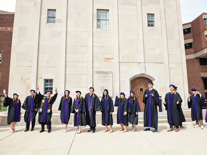 A group of Michigan Law students waiting outside for graduation.