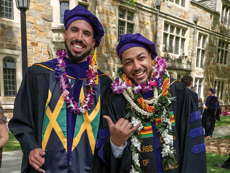 Michigan Law students sharing a friendly shaka hand gesture Michigan Law students sharing a friendly shaka hand gesture