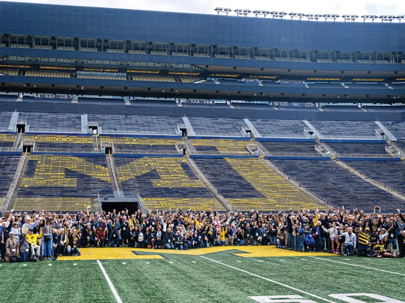 Michigan Law alumni gather on the Michigan Stadium field