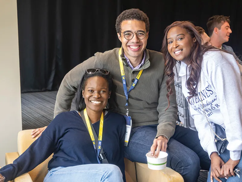 Three Michigan Law alumni pose for a portrait