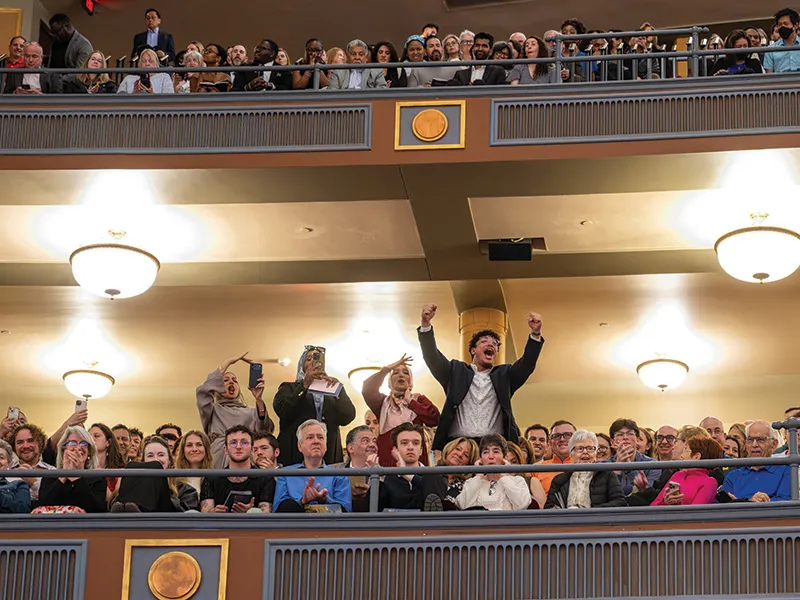 Family cheer for students.