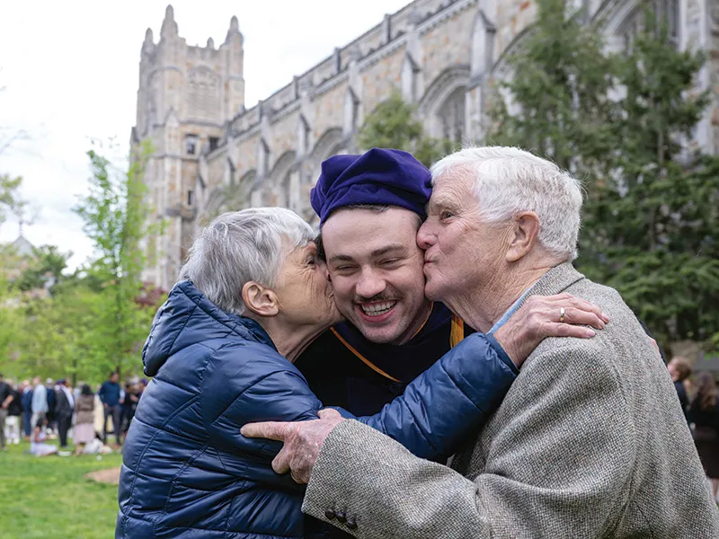 Michigan Law Student receives kisses from family.