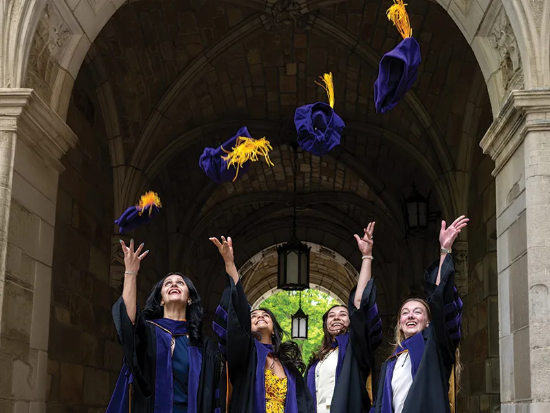 Michigan Law students toss their caps.