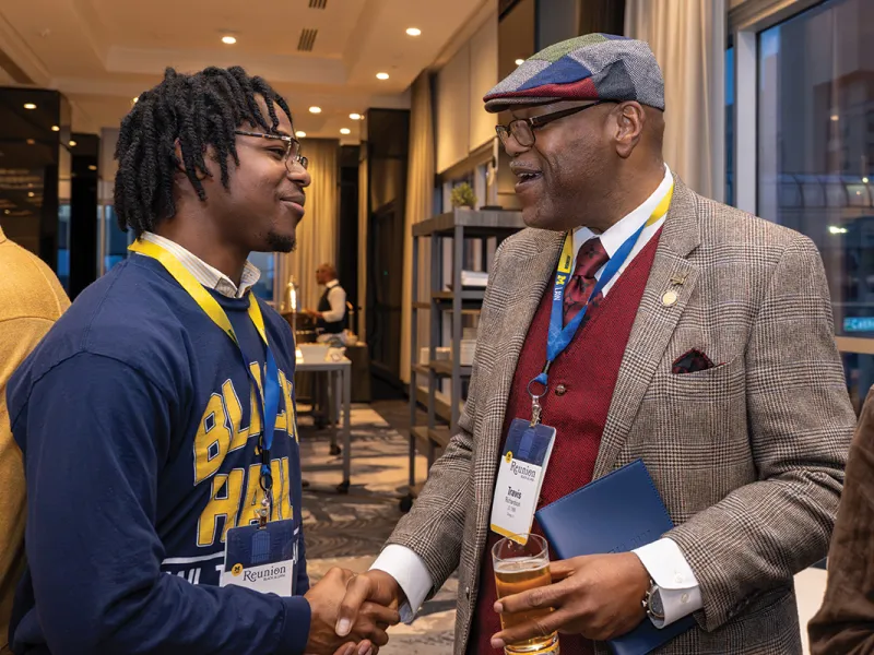 2026 Black Alumni Reunion Travis shakes hand