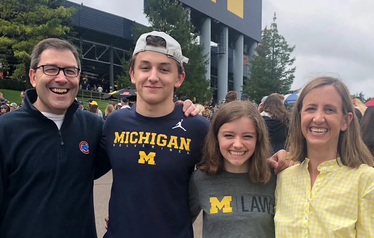 Lacey Sikora and family standing outside the stadium 