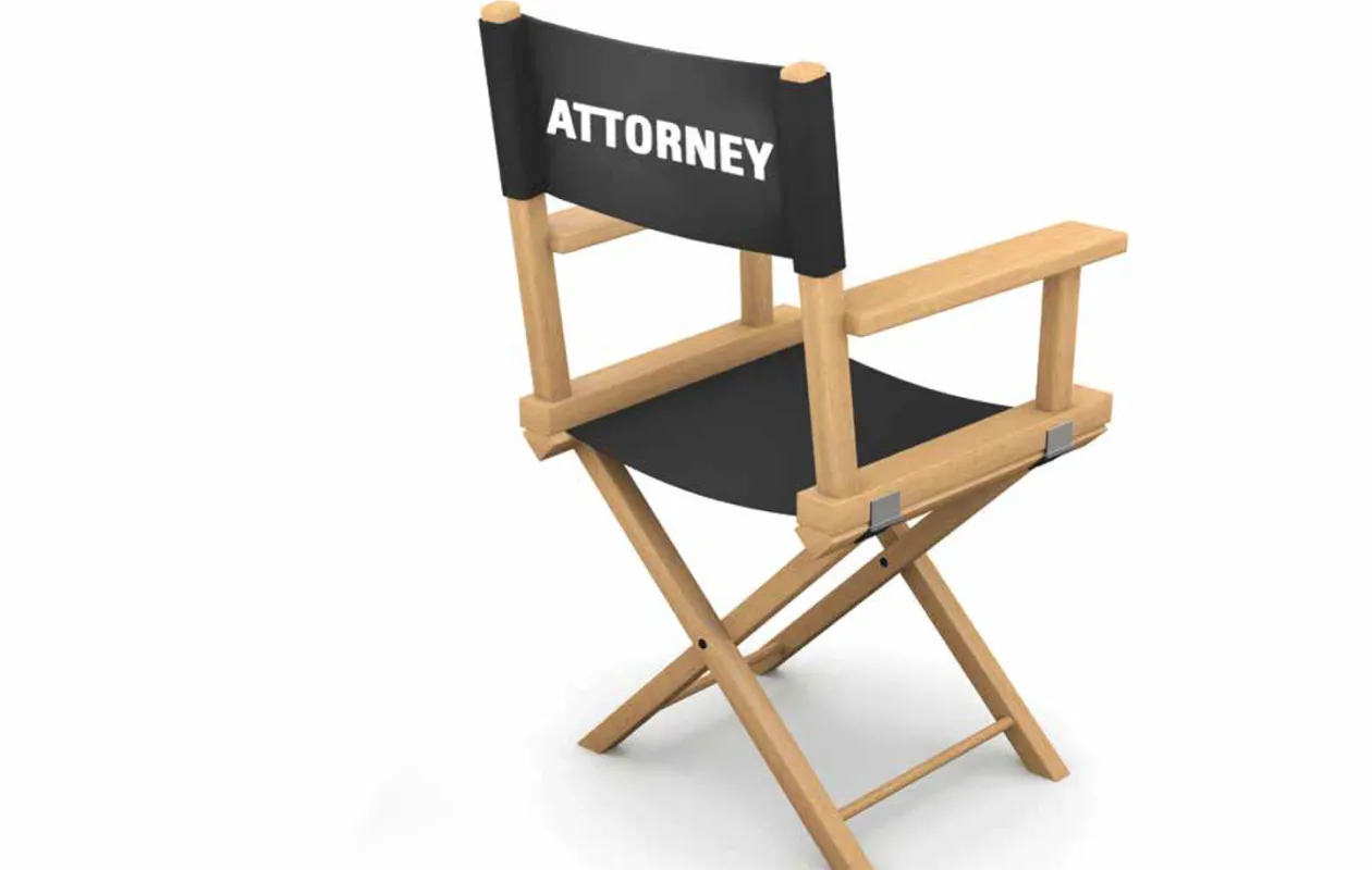 A film chair with the word attorney written on the back