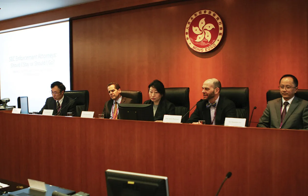 Adam Pritchard, the Frances and George Skestos Professor of Law at Michigan, speaks on a panel with at a conference in Hong Kong