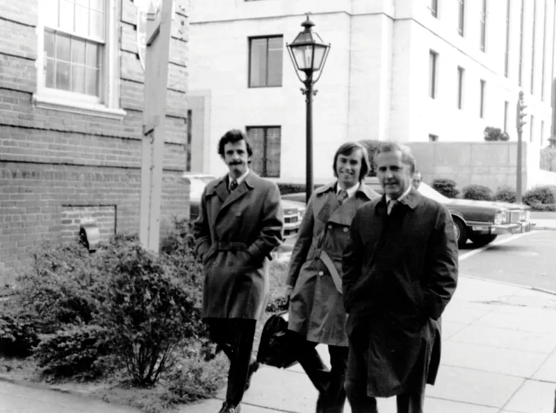 Chuck Barnhill walking to court with two lawyers