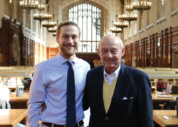 John Boyles with recipient in law library