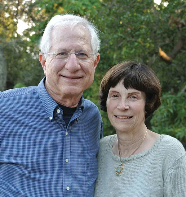 Stephen and Faith Brown posing in front of trees