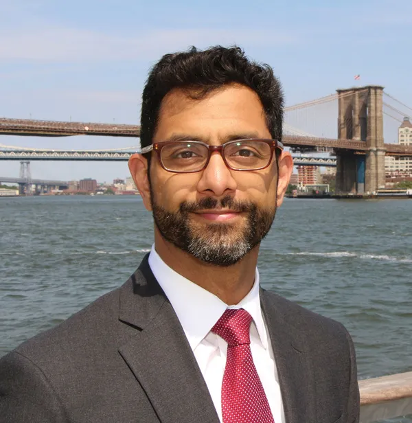 Asim Rehman in front of bridge