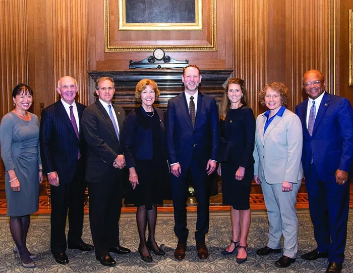 Dean Mark West (center) and May Liang, ’89 (left), who moved for their admission to the Court, are pictured with inductees Richard L. Kay, ’61; Andrew Kay, ’97; Barbara Jane Irwin, ’80; Sophia Hudson, ’06; Maren R. Norton, ’04; and Broderick Johnson, ’83.