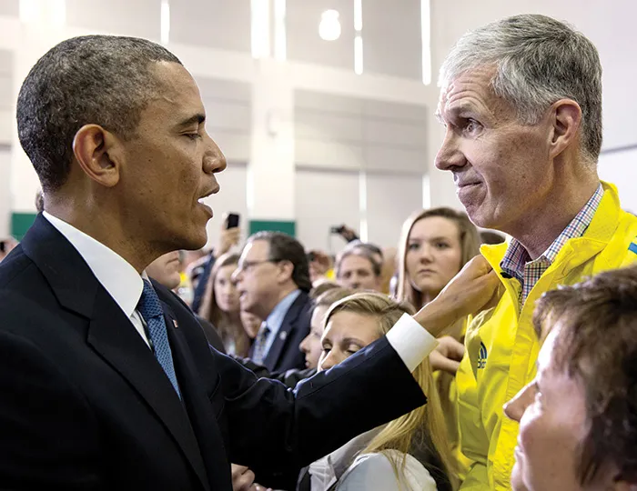 Then President Barack Obama offers encouragement to Grilk  and BAA staff in the wake of the 2013 Boston Marathon bombing.
