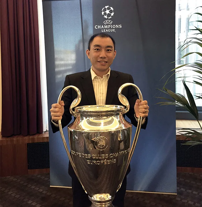  Li poses with the Union of European Football Associations’ championship trophy.