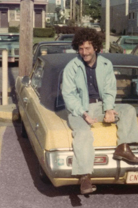 Harvey Shulman, ’72, poses on his 1972 Dodge Dart Swinger, taken during the FCC proceedings in Lansing about 1975.