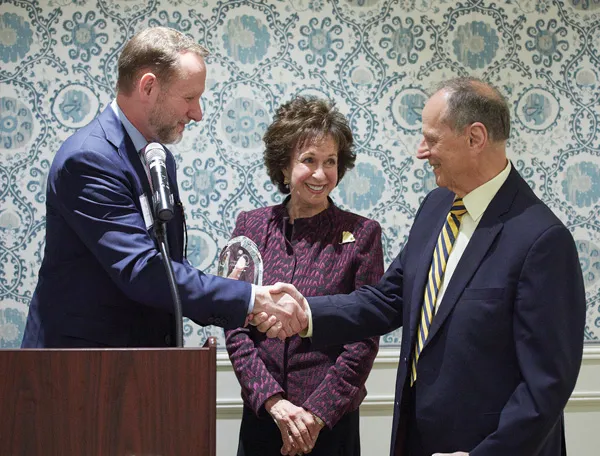 Alan Rothenberg, ’63, pictured with his wife, and Dean Mark West 