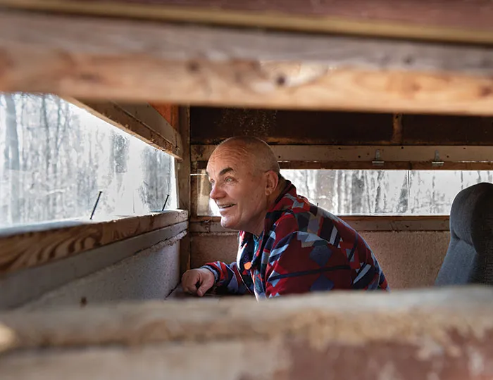 Jeff Titus looking through a window