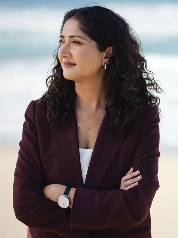 A portrait of Faizah Malik, ’11, at Bruce’s Beach in Manhattan Beach, California.