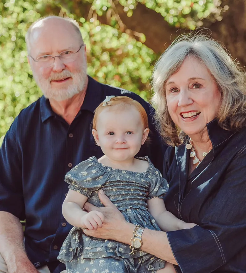 Ambassador W. Robert Kohorst, ’78, with his wife, Shelley Allen, and their granddaughter, Audrey.