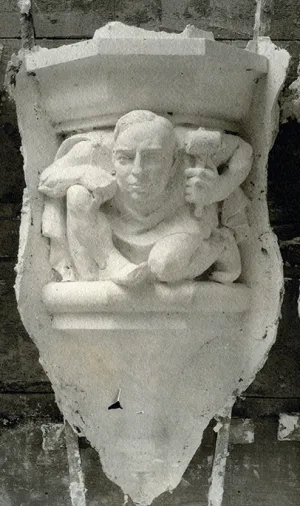A carved figure similar to a gargoyle in a carcicature of past U-M president Marion Burton.