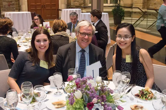 Adelman Scholarship recipients at table with donor