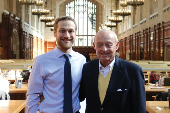 John Boyles with recipient in law library