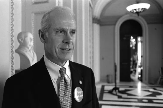 Rep. John E. Porter in an official looking hall way