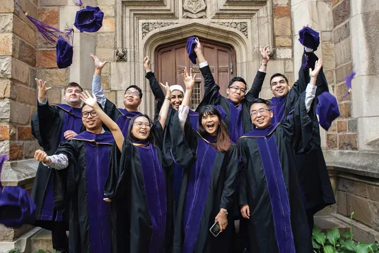 First Class of MACL Graduates. Throwing up their hats with excitement. 