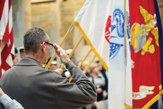 Veterans saluting during the ceremony