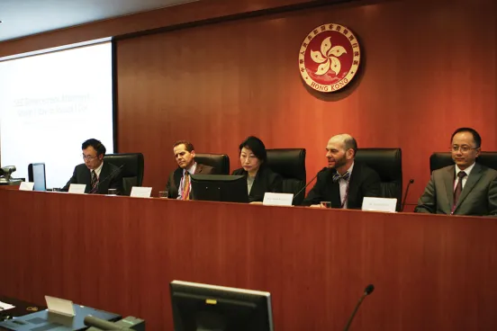 Adam Pritchard, the Frances and George Skestos Professor of Law at Michigan, speaks on a panel with at a conference in Hong Kong