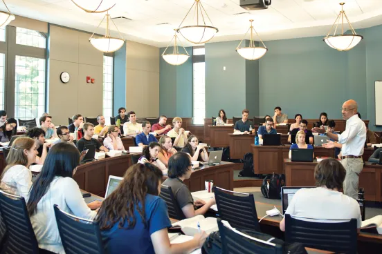 Students being lectured to and learning in the classroom at Law School 