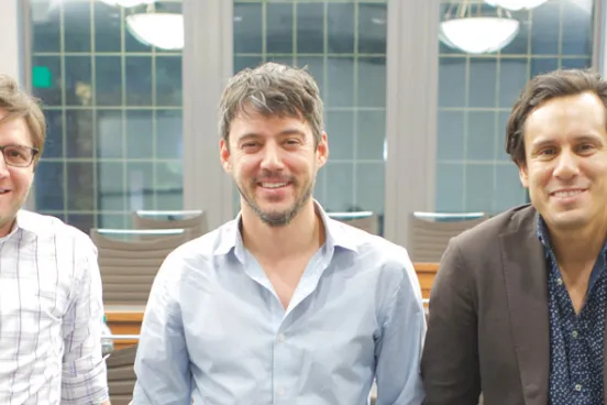 James Blakemore, ’13 (left), and Josh Garcia, ’13 (right), with their business partner, Zachary Fallon.