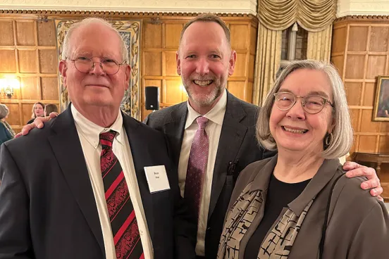 Faculty gathered in March for a pandemic-delayed celebration of Bruce Frier and Christine Whitman’s retirements. They are pictured at the dinner with Dean Mark West (center).