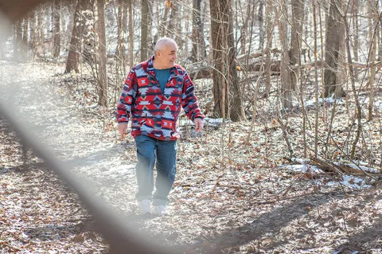 Jeff Titus walks in the woods after being exonerated.